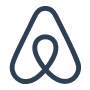 Abstract geometric logo on black background.